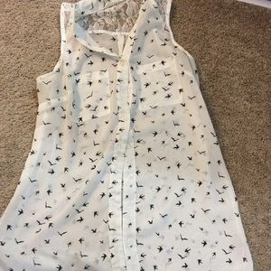Sleeveless white shirt with black bird design
